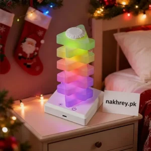 Triangle rainbow night light glowing with multi-color LEDs on a shelf